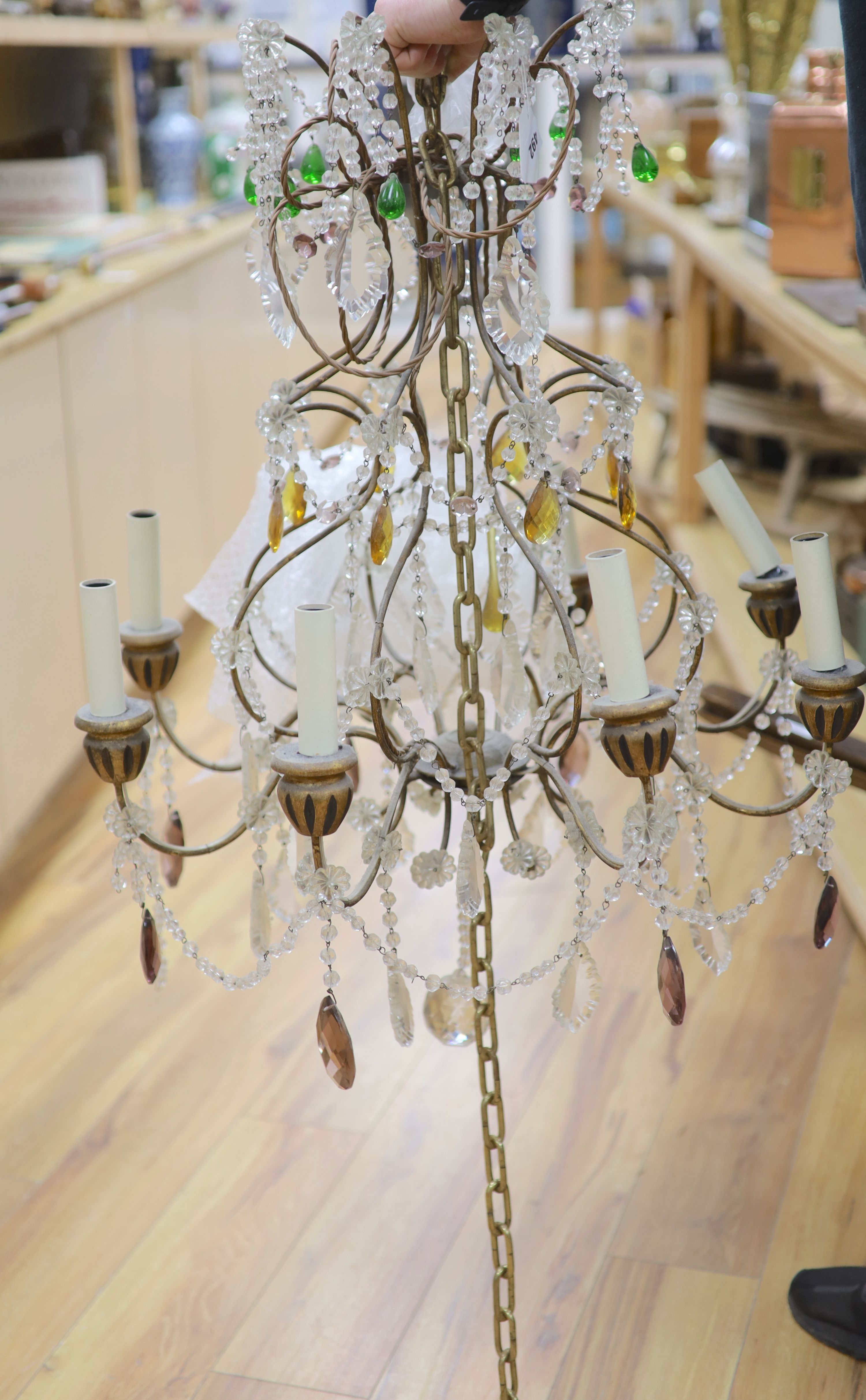 An eight branch glass drop chandelier